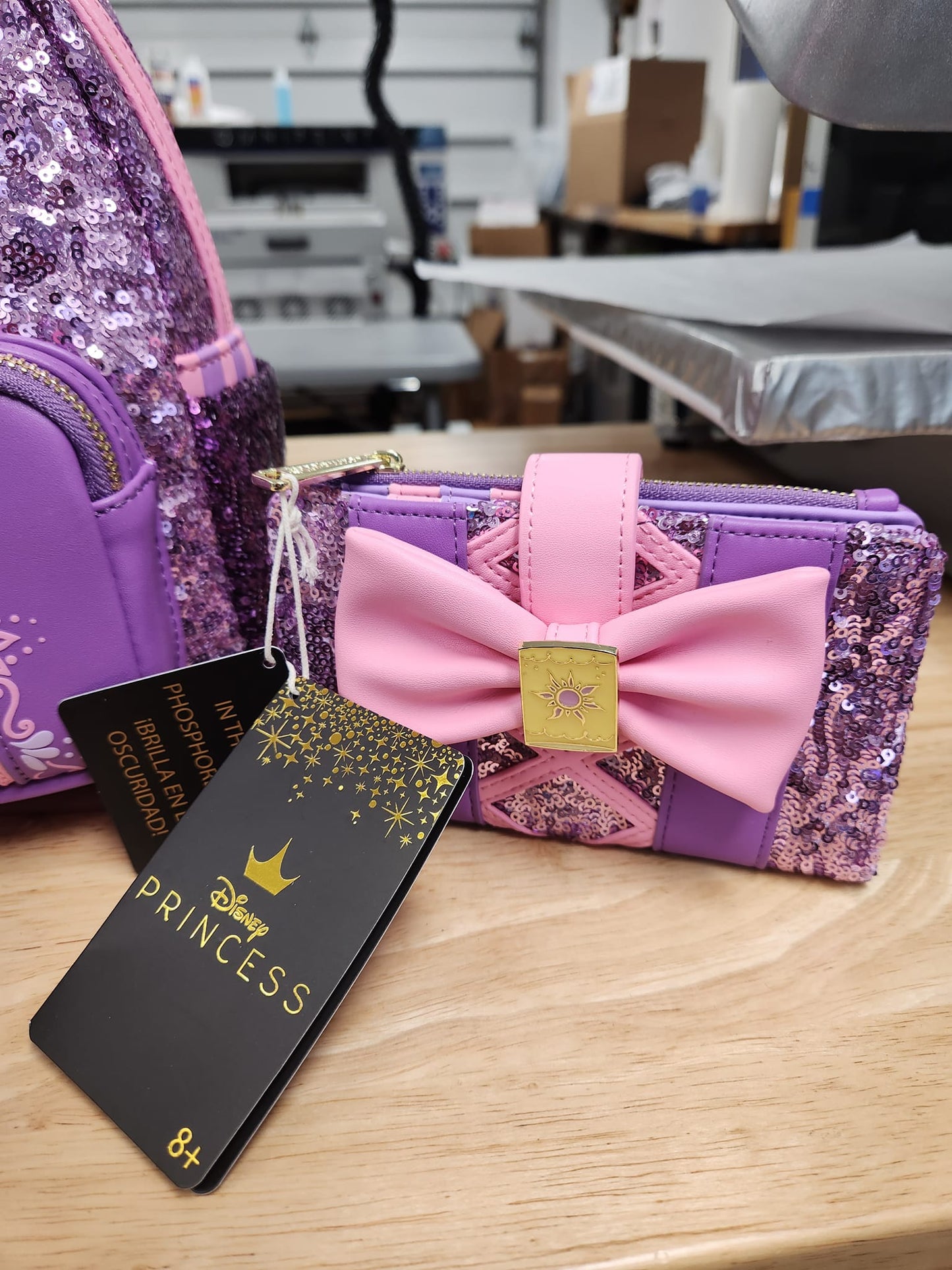 LOUNGEFLY REPUNZEL SEQUIN GLOW BOW SET (BACKPACK AND WALLET)