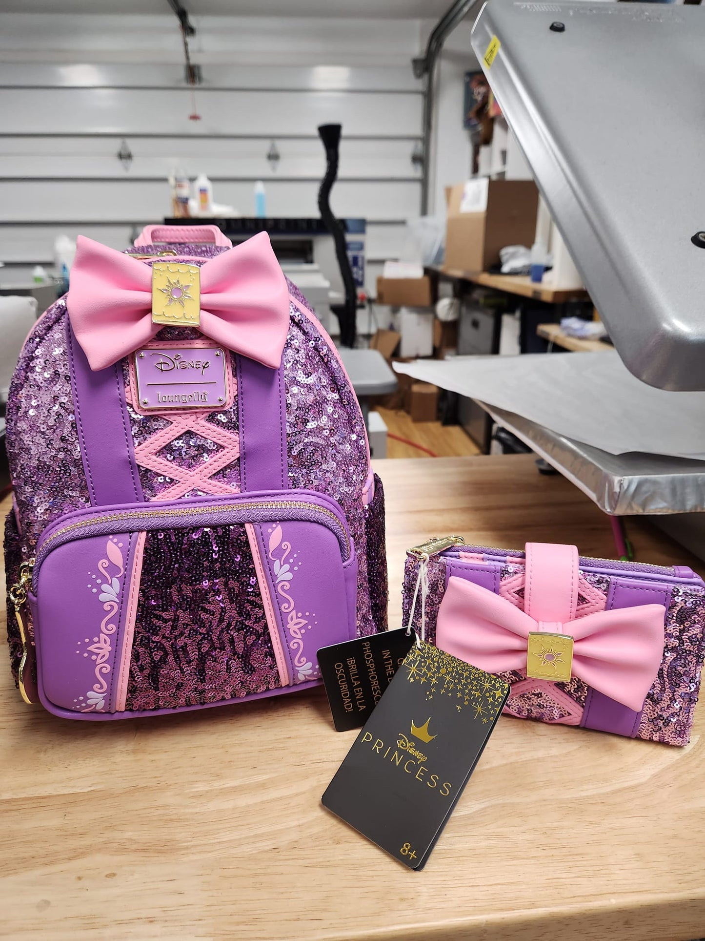 LOUNGEFLY REPUNZEL SEQUIN GLOW SET (BACKPACK AND WALLET)