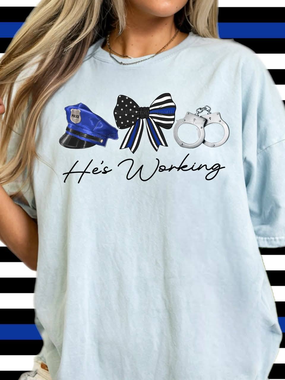 HE'S WORKING POLICE TEE