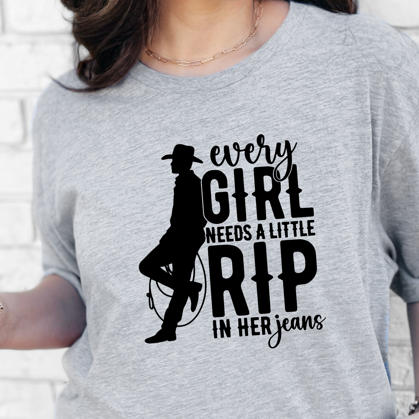 A Little Rip in her Jeans Graphic Tee