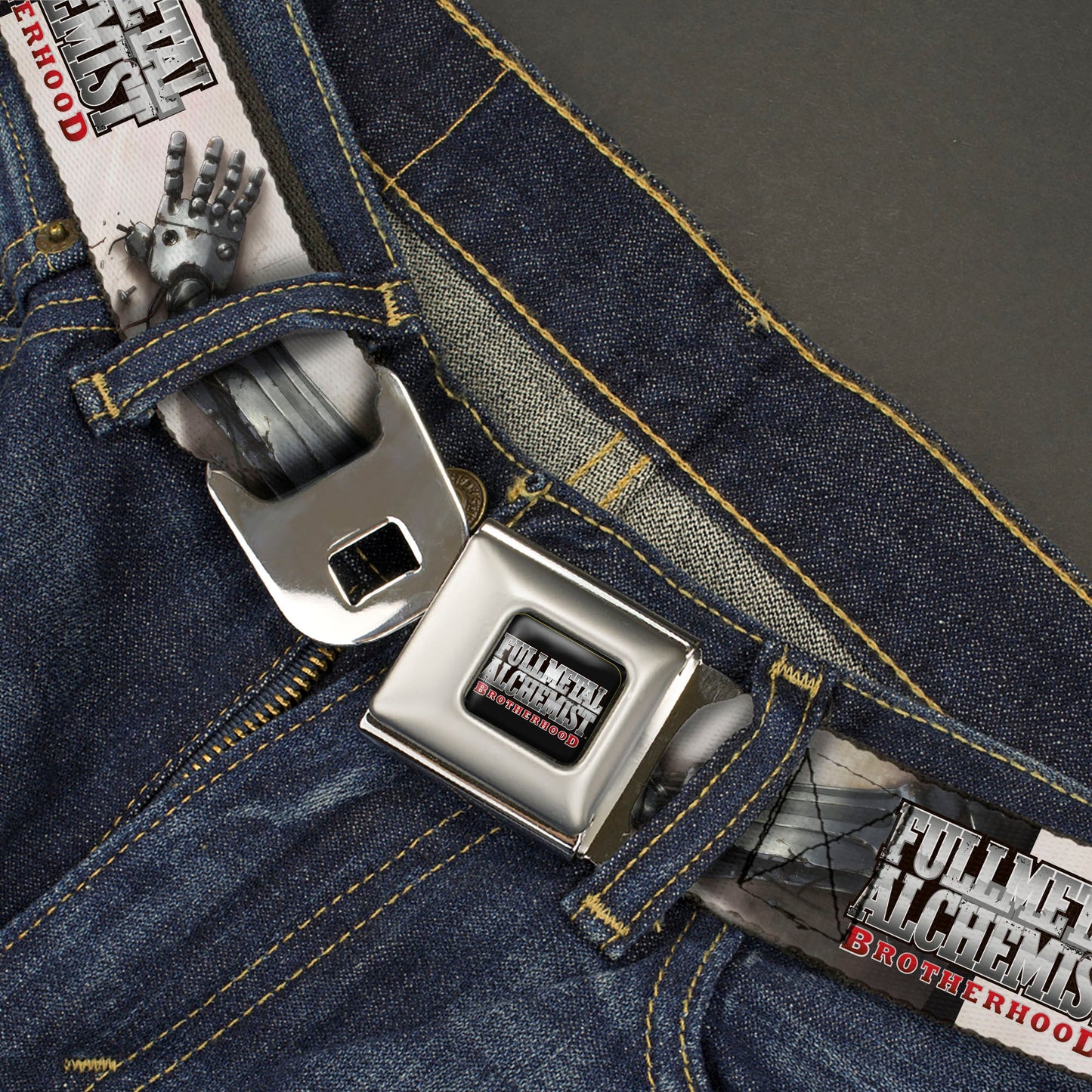 FULLMETAL ALCHEMIST BROTHERHOOD Title Logo Full Color Black Seatbelt Belt - FULLMETAL ALCHEMIST BROTHERHOOD Edward Elrics Automail Arm Tan Webbing
