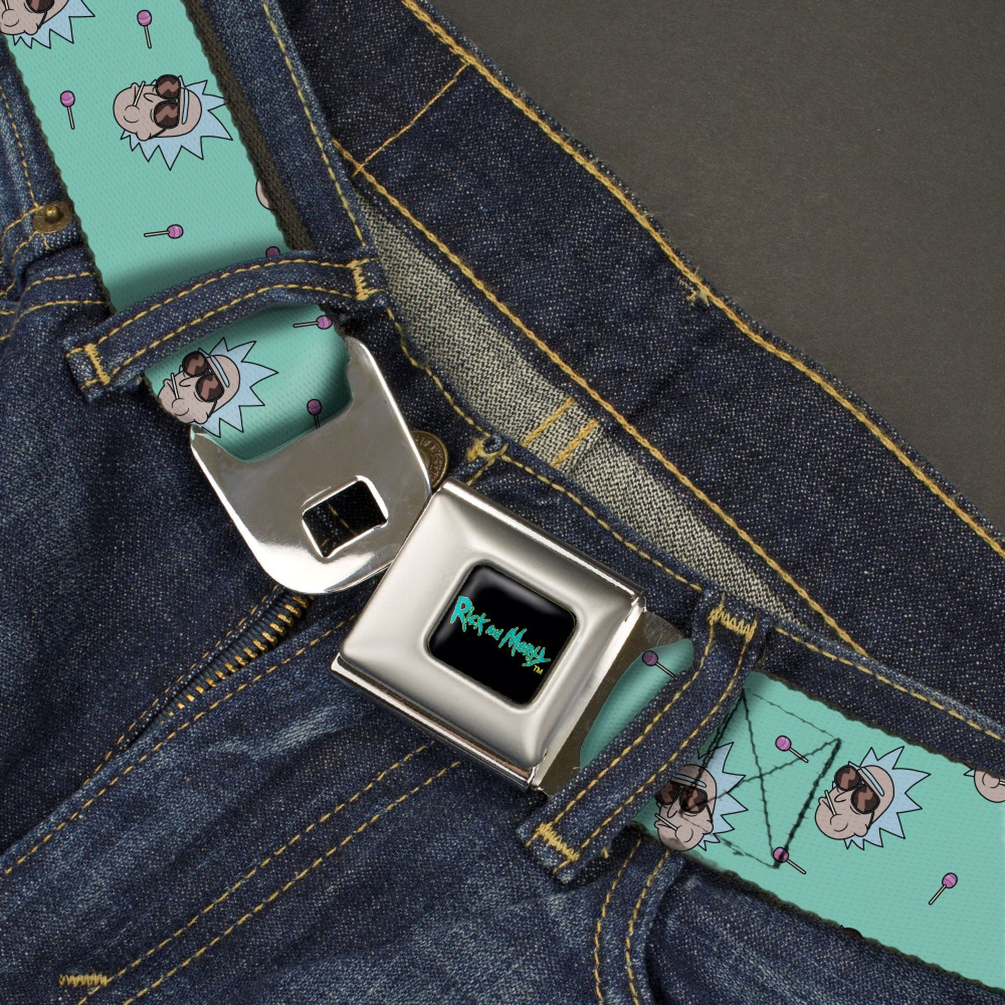RICK AND MORTY Text Logo Full Color Black/Blue Seatbelt Belt - Rick and Morty Rick Lollipop Pose Scattered Teal Webbing