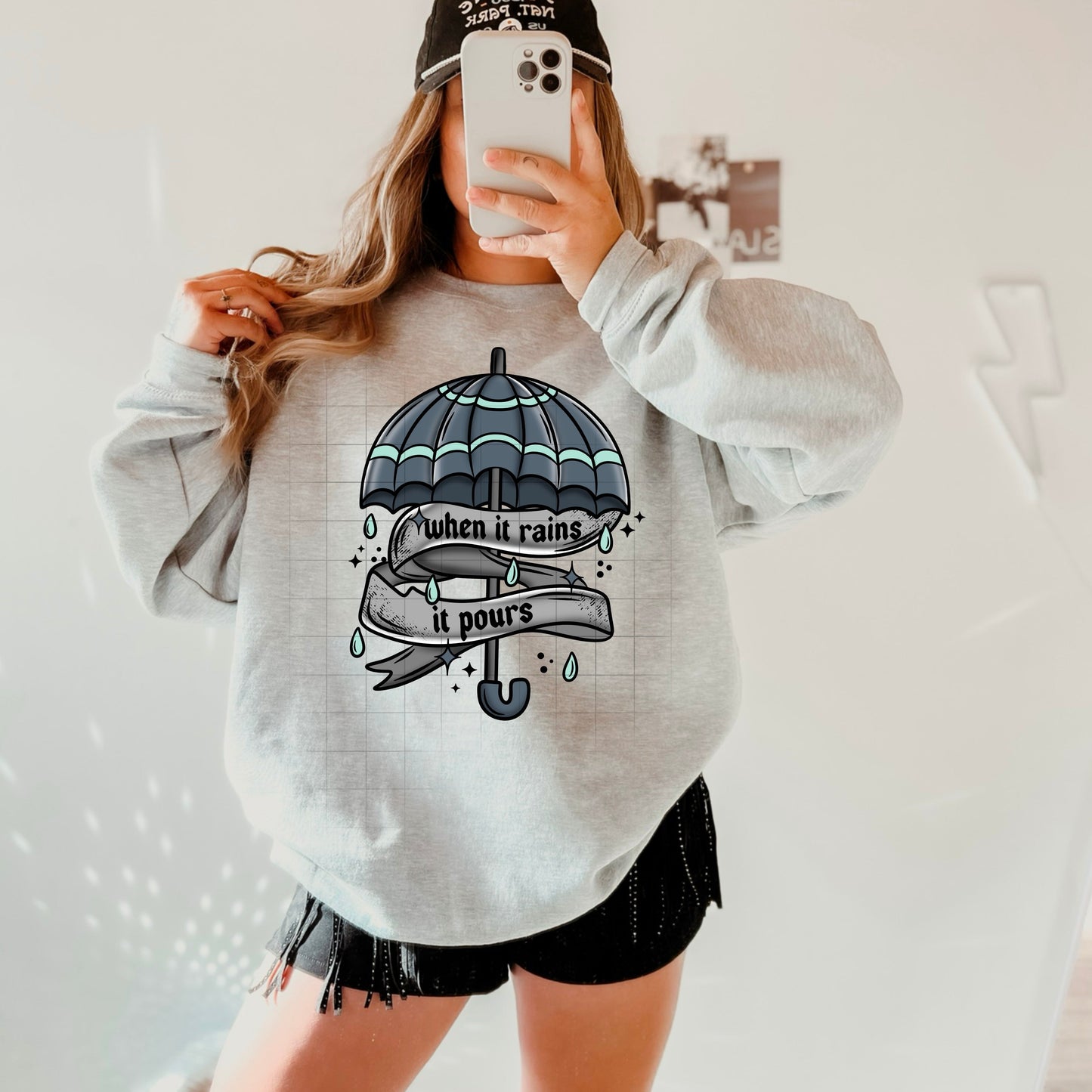 WHEN IT RAINS SWEATSHIRT