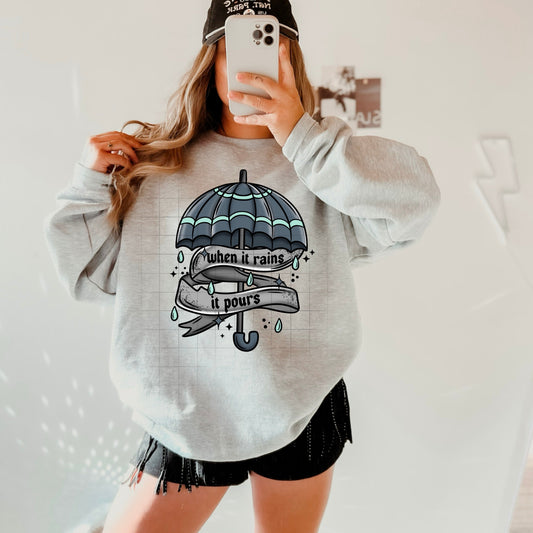 WHEN IT RAINS SWEATSHIRT